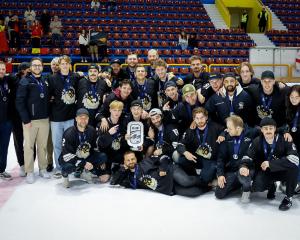 The Ice Blacks celebrate second place at their world tournament in Sofia yesterday. PHOTO: ICE...