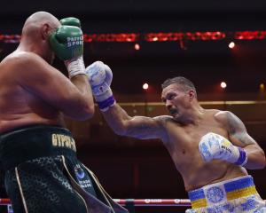 Oleksandr Usyk throws a right at Tyson Fury. Photo: Action Images via Reuters