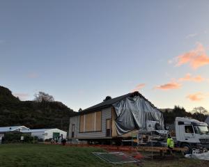 The first section of the former Queenstown Arts Centre building arrived at Country Lane on...