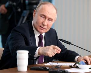 Russian President Vladimir Putin at a forum with international news agency editors in St...