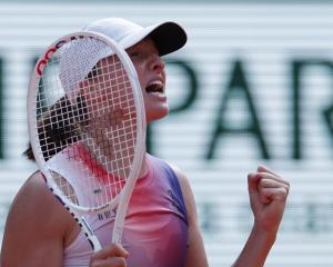 Iga Swiatek celebrates winning her semi-final match against Coco Gauff. Photo: Reuters 
