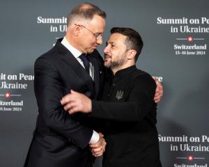 Poland's President Andrzej Duda (left) is welcomed by Ukraine leader Volodymyr Zelenskyi at the...