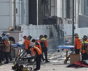 Emergency personnel at the scene of the fire in Hwaseong. Photo: Reuters