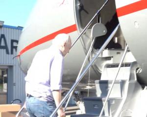WikiLeaks founder Julian Assange boards a plane at a location given as London, Britain, in this...