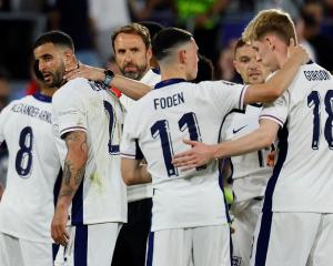 England manager Gareth Southgate with players after the match. Photo: Reuters 