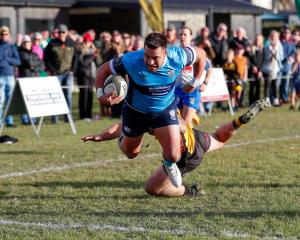 Xavier Sadler finds the tryline for Wakatipu during the White Horse Cup game against Upper Clutha...