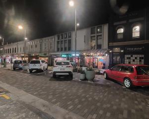 Vehicles on a Friday evening remain in an area of George St, Dunedin, that is not designed for...