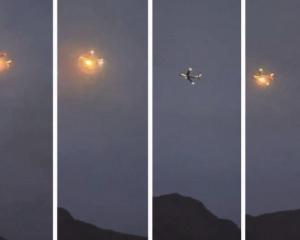 A sequence of shots showing flames coming from the engine of flight VA148 after it was damaged...