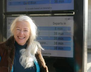 ORC transport committee chair Alexa Forbes in front of the new real-time bus screens in Frankton....