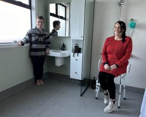 Alexandra woman Carla Hill and her son Nate check out the bathroom voluntarily remodelled by...