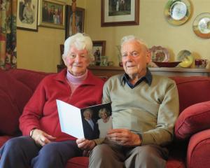 Donalda and Jim Mitchell with the congratulatory card they received from King Charles and Queen...
