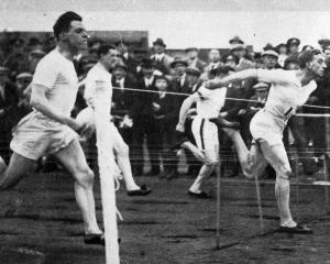 Harold Abrahams wins the 100 yards in 9 3/5 sec, equalling the world record, at the Woolwich and...