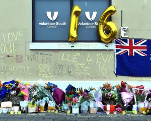 Flowers where Enere McLaren-Taana was fatally stabbed at the Dunedin bus hub in Great King St....