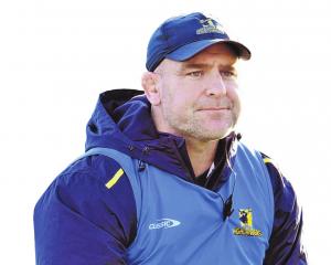 Highlanders coach Clarke Dermody monitors a training session at the University Oval this week....