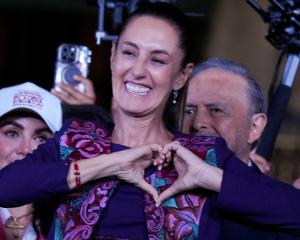 Claudia Sheinbaum gestures to supporters in Mexico City after winning the presidential election....