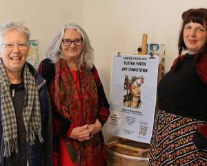 Lawrence Community Arts volunteers (from left) Jan Harper, Karen Armstrong and Rachel Taylor are...