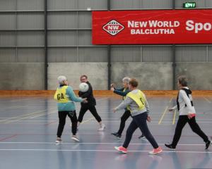 Walking netballers pass the ball down the court in a game last week in Balclutha.PHOTOS: EVELYN...