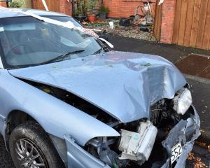 A car that crashed into a property in Church St, Mosgiel in May 2023 was badly damaged. PHOTO:...