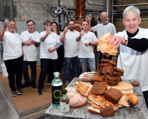 Dunedin Craft Distillers co-founder Sue Stockwell wrings water from bread as staff (from left) Su...