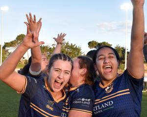 Dunedin players (from left) Grace Guyton-Voyce, Erin Adams and Amoe Wharehinga celebrate their win.