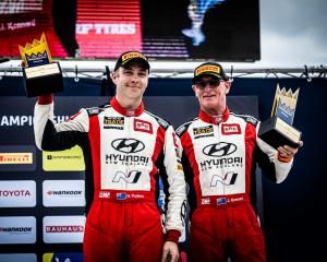 Hayden Paddon (left) and John Kennard celebrate third place at the Royal Rally of Scandinavia....