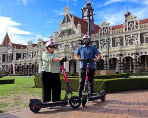 Michaela and Harman Gill, of Dunedin, test drive new Flamingo scooters ahead of their arrival in...