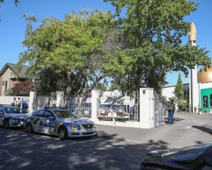 Police vehicles parked outside Al Noor Mosque in Christchurch. Photo: Getty Images