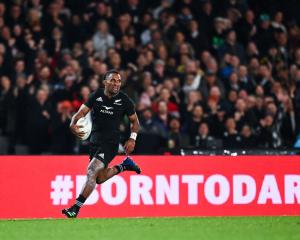 All Blacks winger Sevu Reece breaks away for a try against Ireland during a test at Eden Park in...