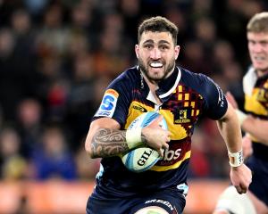 Nikora Broughton of the Highlanders charges forward against the Crusaders at Forsyth Barr Stadium...