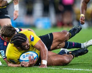 Pasilio Tosi of the Hurricanes dives over to score a try during the Super Rugby Pacific Quarter...