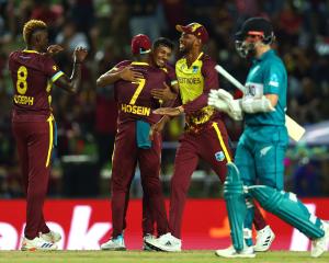 West Indies players celebrate the wicket of New Zealand captain Kane Williamson. Photo: Getty Images