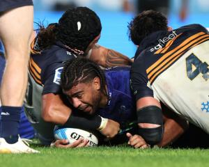 No 8 Hoskins Sotutu scores one of the Blues’ five tries in their Super Rugby Pacific semifinal...