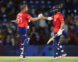 England's Jonny Bairstow and Phil Salt celebrate their victory over West Indies in Gros Islet,...