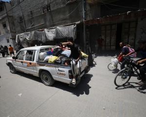 Palestinians flee Gaza City after another Israeli attack. Photo: Getty Images