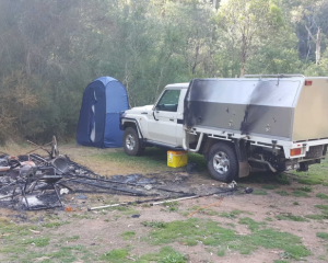 The pair's campsite was found burnt, but Mr Hill's car was still there. Photo: Supplied