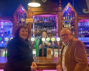 Waxy’s Irish Pub team member Shanaya Muir (centre) and ILT trustees Angela Newell and Sean Bellew...