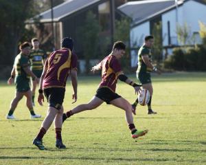 Canterbury University’s Ollie Burra shapes to kick during his side’s 38-7 win over Belfast. PHOTO...