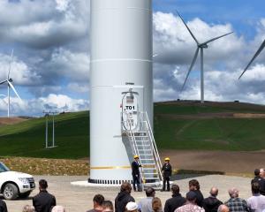 Turning a sod to start construction of the Kaiwera Downs wind farm was the first official...