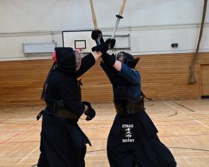 Otago Kendo Club members Liam Domett-Potts, 23 (left), and Oscar Berry, 15, practise their kendo...