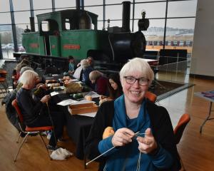 Dunedin Spinners and Weavers Guild treasurer Susan Butt leads the knitting troupe in making...