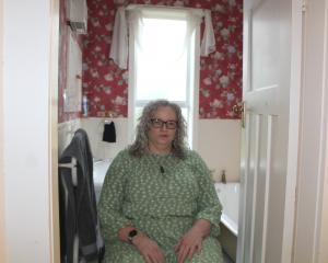 Melanie Magowan in her inside bathroom which she says is not suitable for her. PHOTO: NINA TAPU
