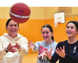 Jodi Brown has been playing club basketball with her daughters, Aria, 13 (left), and Kiana, 15....