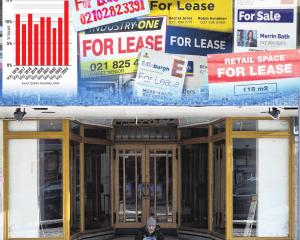 A man sits in front of an empty shop in George St. The number of vacant stores along the central...