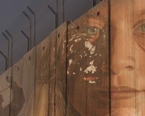 A mural of Ahed Tamimi, who was arrested for slapping an Israeli soldier, by Italian artist Jorit...
