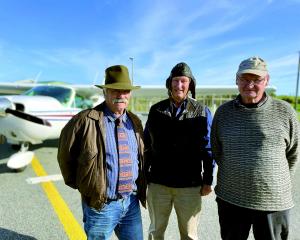 Murray Bowes (left) and Greymouth Aeroclub president Dave McMillan flank pilot Tom Williams on...