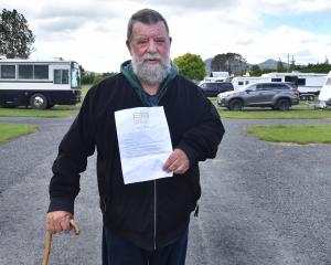 Craig Reeves show the eviction notice that last year moved him out of the Taieri A&amp;P...