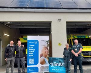 Celebrating the installation of solar panels at St John in Wānaka are, from left, Scott Kiddey,...