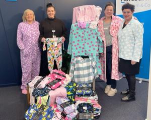 Admiring the new pyjamas donated by Harcourts Temuka to Arowhenua Whānau Services are (from left)...