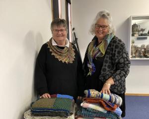 Creative Fibre South Canterbury delegate Sue Sanders (left) accepts a selection of woollen...