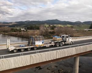 Four new turbines are being installed at the Roxburgh Dam. Below: The dam. PHOTOS: CONTACT ENERGY